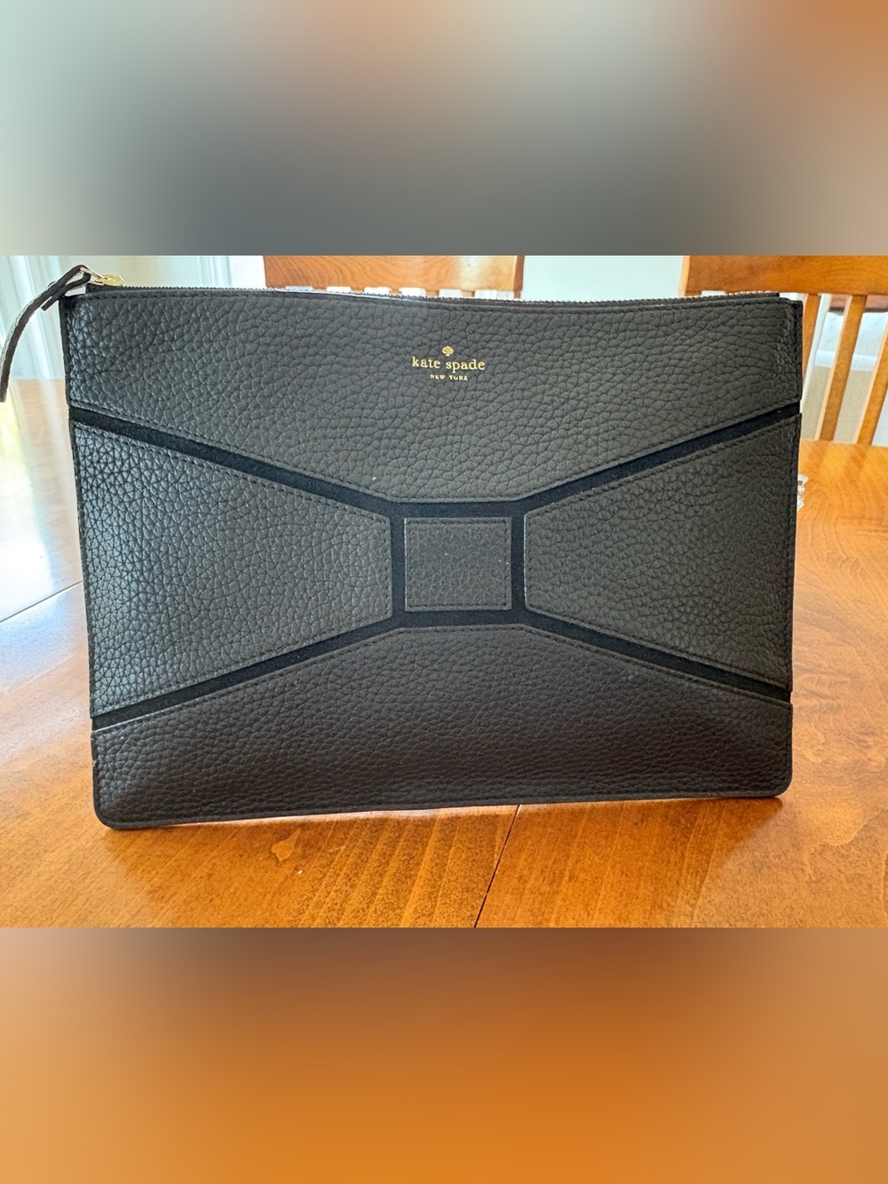 kate spade black pebbled leather clutch with gold logo